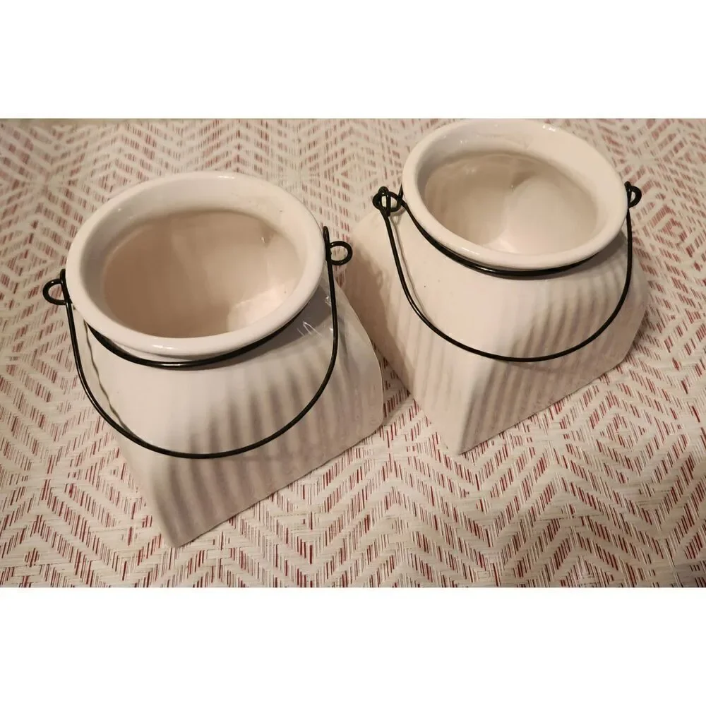 Napco cream ceramic jars with metal wire hangers